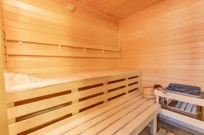 a wooden sauna with a bench in it at Hotel Wilhelm in Prague