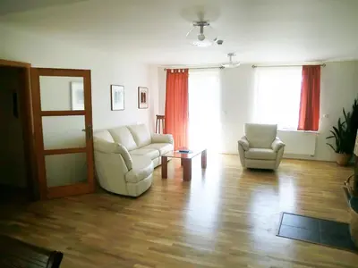 a living room with a couch and two chairs at Pension Rondel in Poděbrady