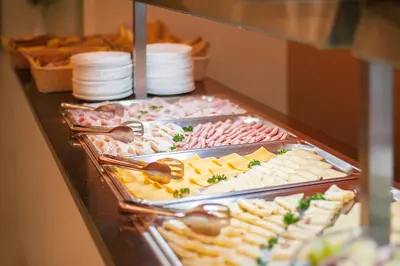 a buffet line with many different types of food at Hotel Pivovar in Prague