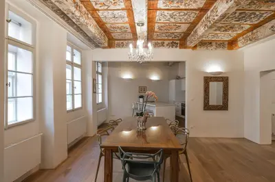 a dining room with a table and chairs at 18th CENTURY BAROQUE RESIDENCE in Prague