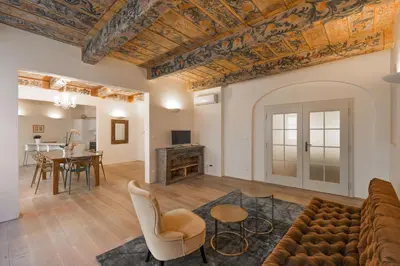 a living room with a couch and a table at 18th CENTURY BAROQUE RESIDENCE in Prague