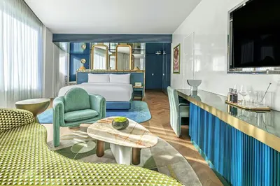 a hotel room with a bed and a table at W Prague in Prague