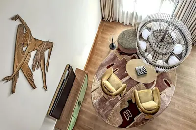 an aerial view of a living room with a table and chairs at W Prague in Prague