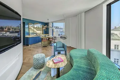 a living room with a couch and a table at W Prague in Prague