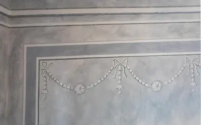 a painting of a chain on a curtain at Loreta Hotel in Prague