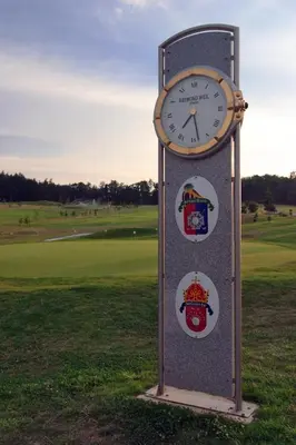 a clock sitting in the middle of a field at Golf Resort Hotel Konopiště in Benešov