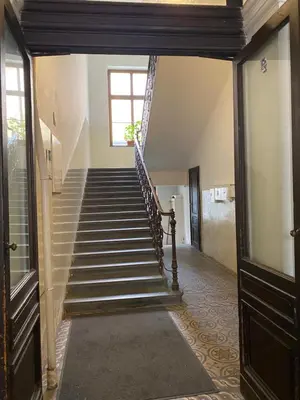 a hallway with stairs in a building at Hostel EMMA in Prague