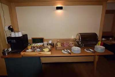a table with food and plates on top of it at Hotel Soudek in Poděbrady