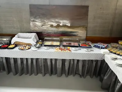 a buffet line with food on a table at Pivotel MMX in Dobřichovice
