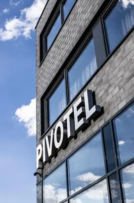 a sign on the side of a building at Pivotel MMX in Dobřichovice