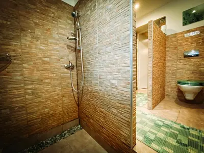 a bathroom with a shower and a toilet at Resort Svět in Úžice