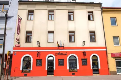 an orange and white building on a city street at Residence Hattrick in Prague