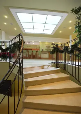a set of stairs in a building with a skylight at Dolce Villa in Prague