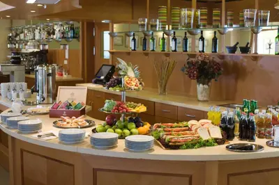 a buffet with a lot of food on a table at Dolce Villa in Prague