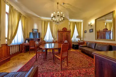 a living room with a table and a couch at Betlem Club Hotel in Prague