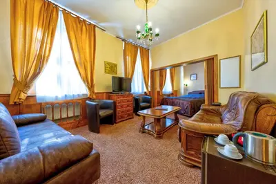a living room with a couch and a bed at Betlem Club Hotel in Prague