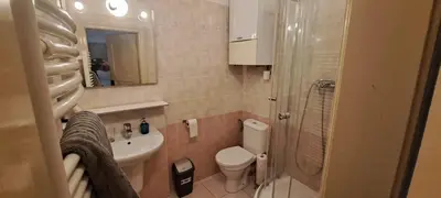 a small bathroom with a toilet and a sink at Apartments in Mala Strana - 10 minutes from Charles Bridge in Prague