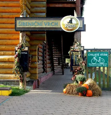 an entrance to a store with pumpkins and a sign at Sport-hotel Šibeniční vrch in Mnichovice