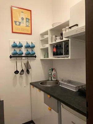 a kitchen with a sink and a counter top at Hostel Praha Ládví in Prague