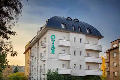 a building with a scientology sign on it at Hotel Otar in Prague