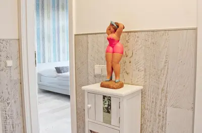 a statue of a woman standing on top of a dresser at Royal Court Legerova in Prague