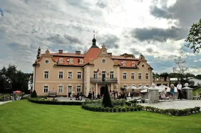 a large building is lit up at night at Hotel Zámek Berchtold in Kunice - Vidovice