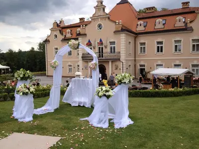 a table with two statues of knights and plates of food at Hotel Zámek Berchtold in Kunice - Vidovice