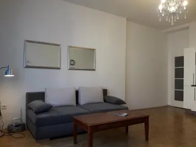 a living room with a couch and a coffee table at Old Town spacious apartment in Prague