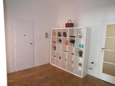 a room with a white book shelf with potted plants at Old Town spacious apartment in Prague