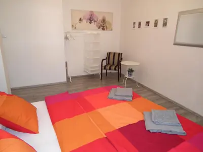 a room with a colorful blanket on a bed at Old Town spacious apartment in Prague