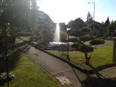 a fountain in the middle of a garden at Fontána in Prague