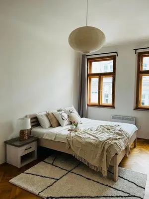 a bedroom with a large bed in a room at Big family apartment in Prague