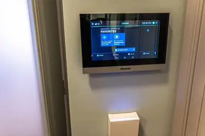 a flat screen tv hanging on a wall at Wishlist Prague Residences - Vinohrady in Prague