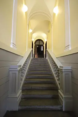 a flight of stairs in an old building at River View Residence in Prague