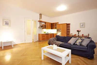 a living room with a couch and a table at Prague Central Residence in Prague