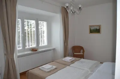 a bedroom with two beds and a window at Pension Nika in Prague