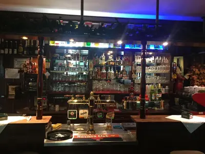 a bar with a lot of bottles of alcohol at Hotel V Pivovaře Davle in Davle