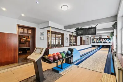 an image of a bowling alley with pins at Hotel V Pivovaře Davle in Davle