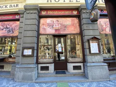 a restaurant with the front door of a building at Hotel Victor in Prague