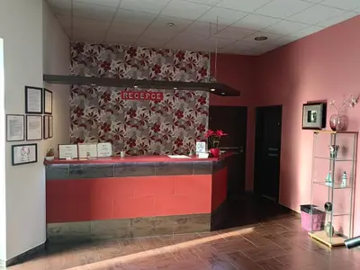 a bar in a restaurant with a red wall at Toscca in Čelákovice