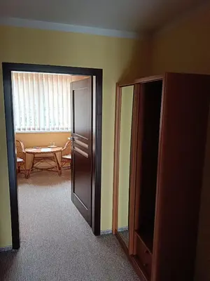 an open door to a room with a table and a dining room at Toscca in Čelákovice