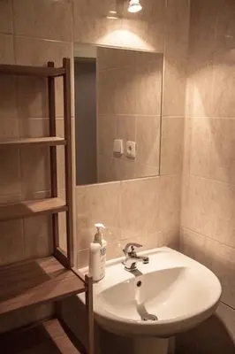 a bathroom with a sink and a mirror at Apartments Emma in Prague