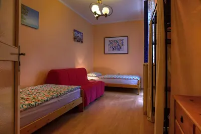 a room with a bed and a chair in it at Apartments Letna in Prague