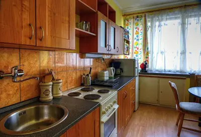 a kitchen with a sink and a stove at Apartments Letna in Prague