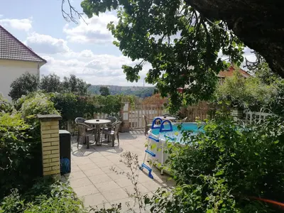 a patio with a table and chairs and a table and a table at Flamingo Apartments in Prague