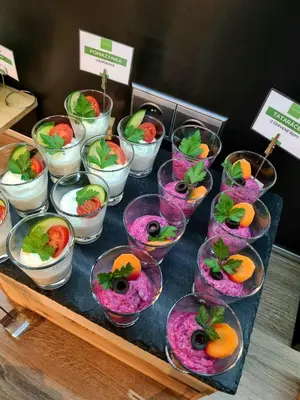 a table with a bunch of different types of food at Resort Lesní Lázně in Zvánovice