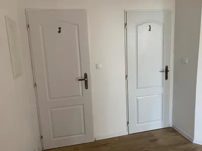two doors in a room with white walls at U mě v domě 26 in Dubá