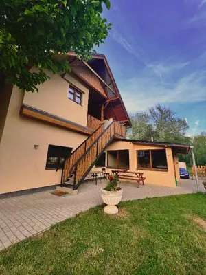 a large house with a staircase and a patio at U mě v domě 26 in Dubá