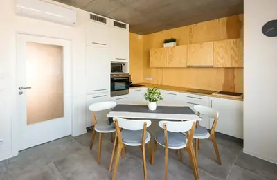a living room with two couches and a table at Residence Trafick in Prague