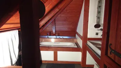 a bathroom with a sink in an attic at 14 Century Water Mill in Mořina